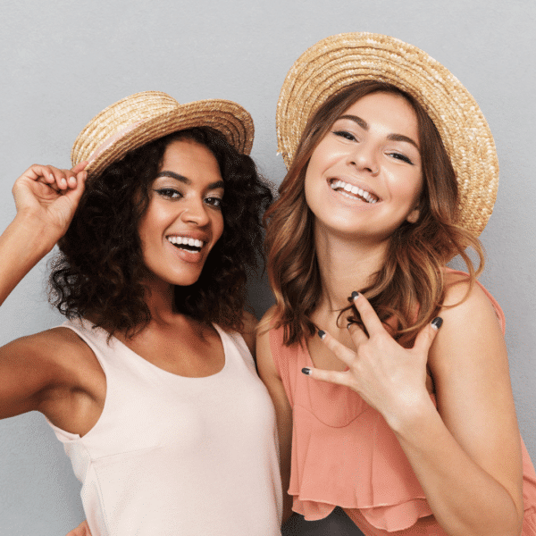 Two women smiling next to each other